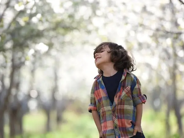 Child smiling and looking into the distance